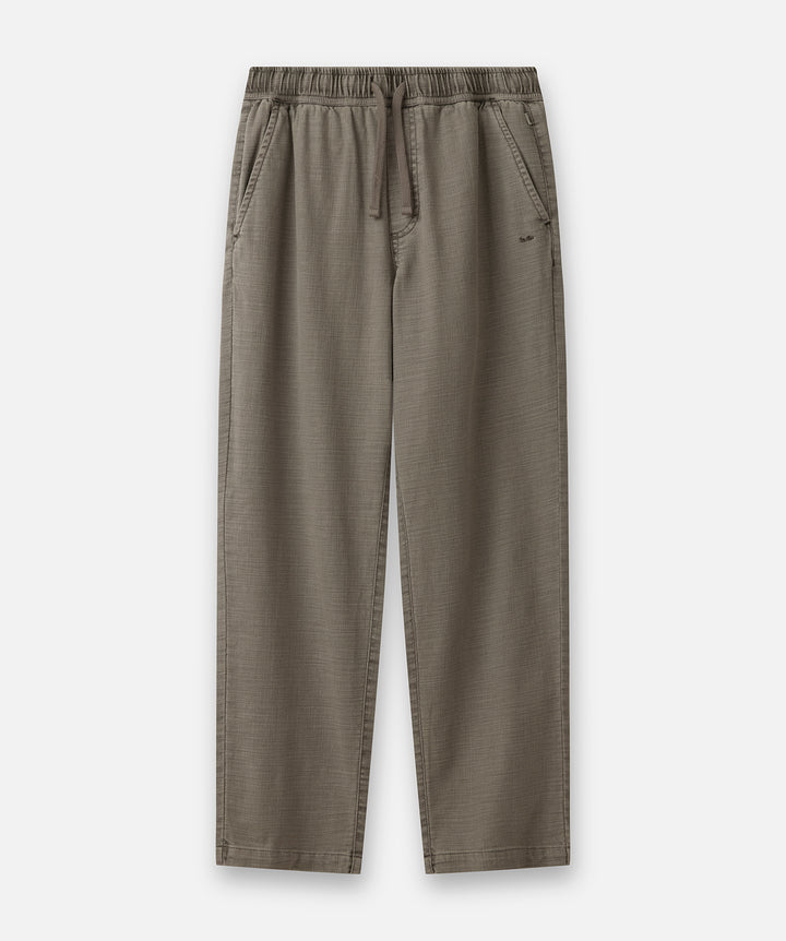 A pair of relaxed-fit trousers in a muted taupe-brown color, featuring an elastic waistband with a drawstring and side pockets, shown flat against a light gray background.